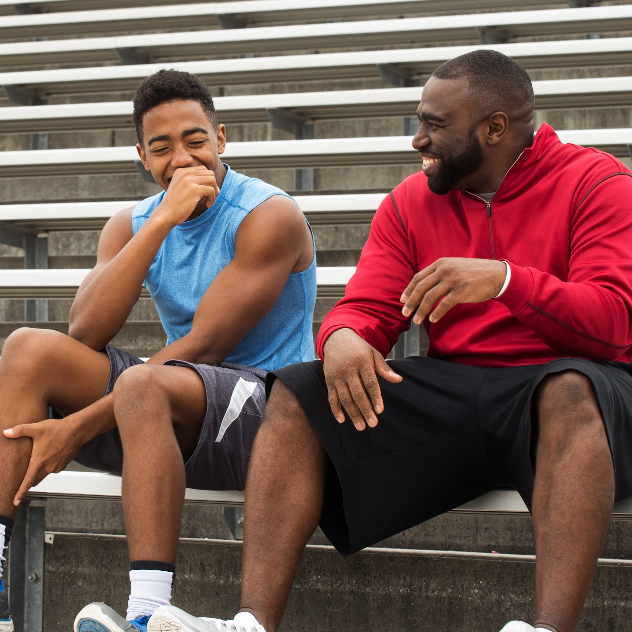 Mentor and role model laughing and spending with the youth. Mentor and role model laughing and spending with the youth.