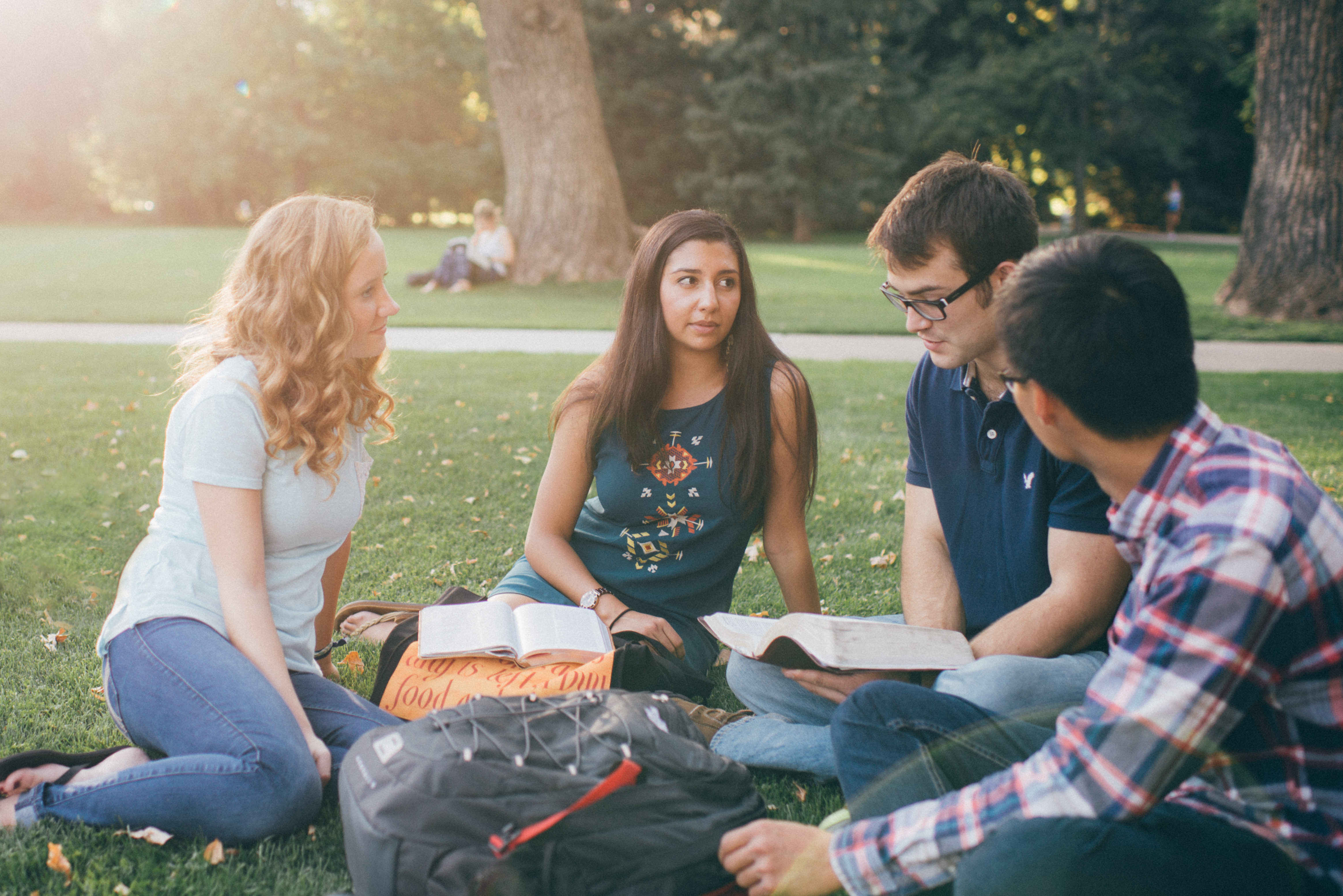 4 Students studying the Bible together