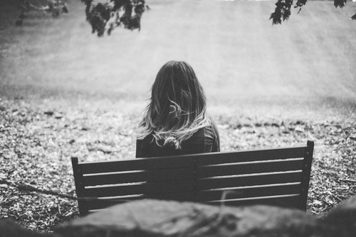 A woman sitting on a bench