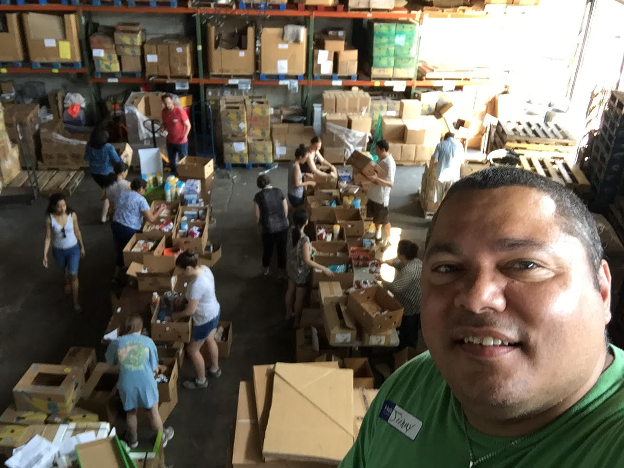Jimmy Badillo with others packing Boxes of Love.