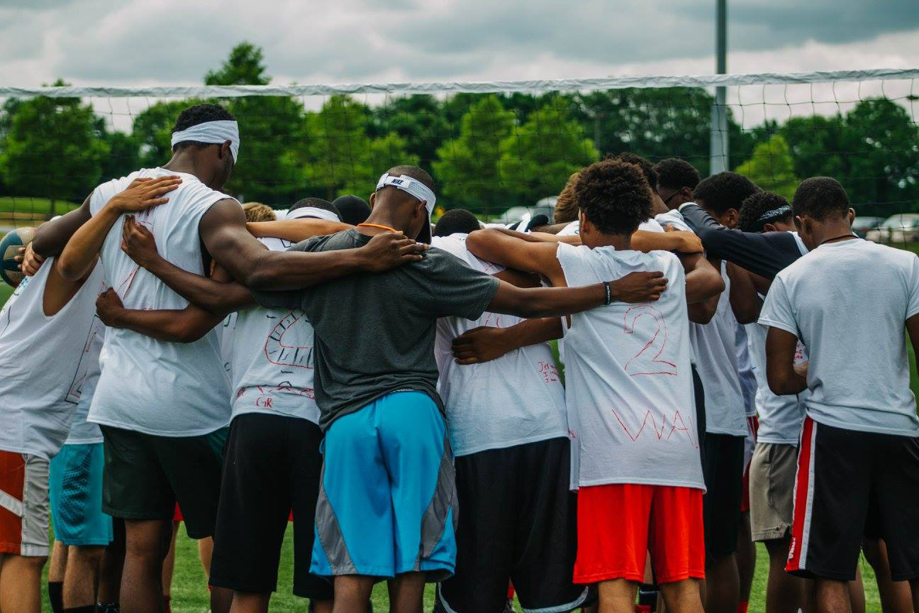 group prayer at camp