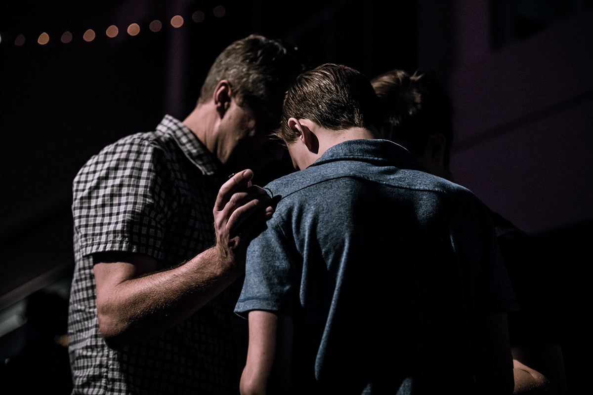 men praying