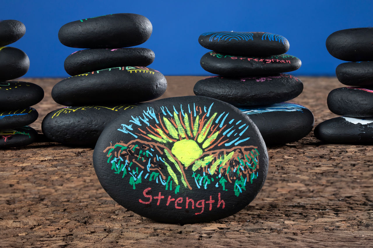 "Why do we pray" article illustrations using painted river rocks. 
