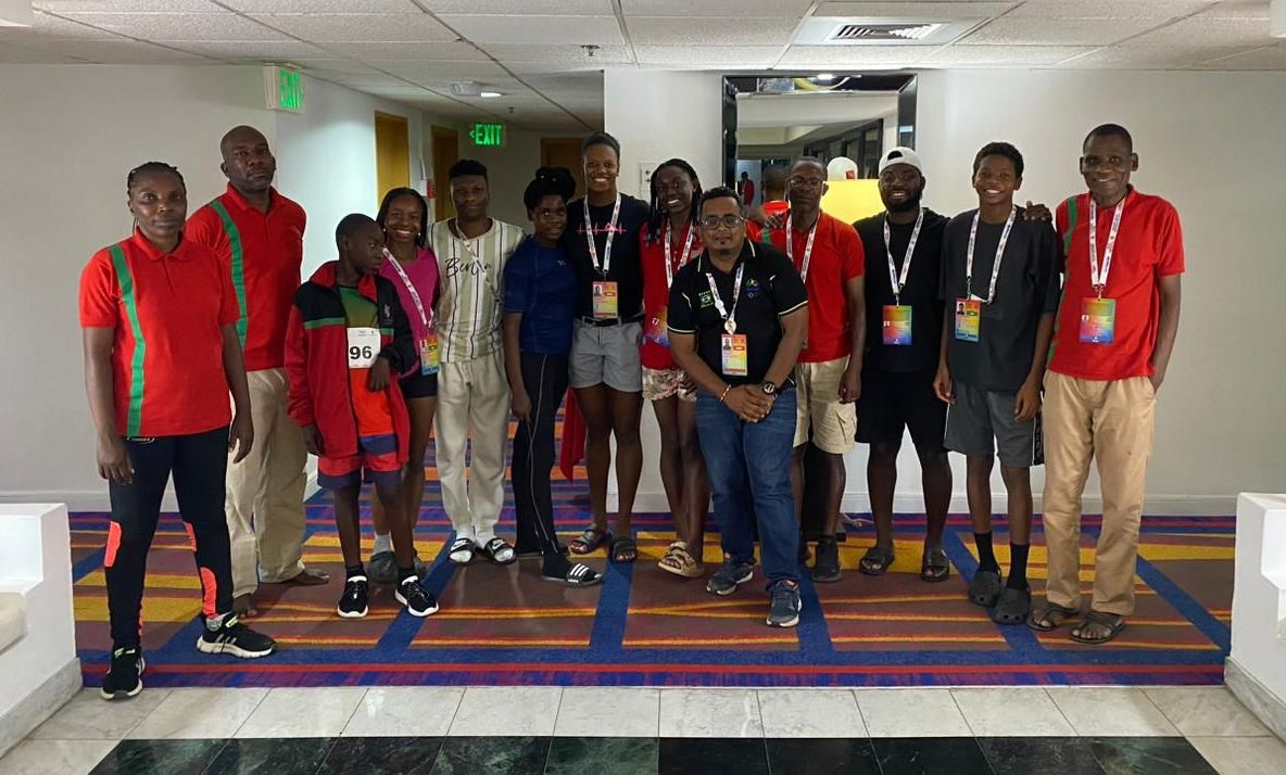 AIA Team Leader, Kameel Mongru (centre, black shirt with blue jeans pants), is pictured here alongside members of the Malawi contingent at the 2023 Commonwealth Youth Games.