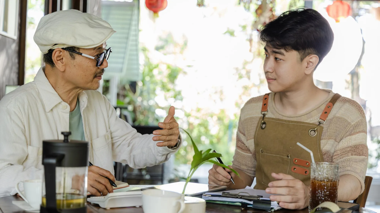 Two people conversing across generational gaps.
