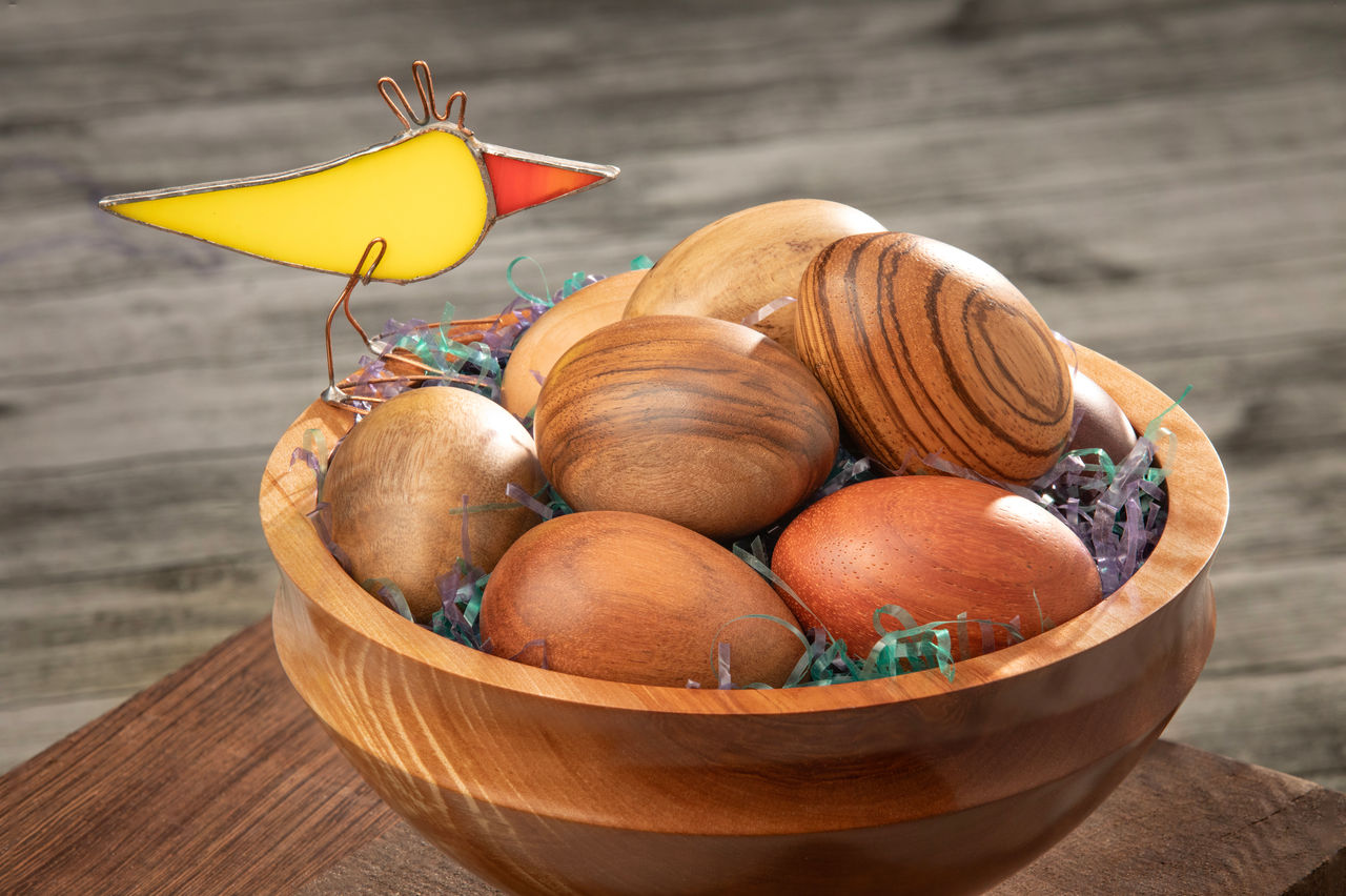 Easter egg photo for Cru.org, Wood eggs in bowl, with glass bird.